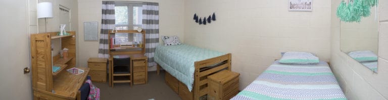 A panoramic view of a room inside  on of our residence hall.