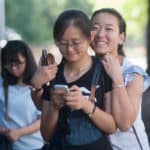 From left, Lynn Lu, Daisy Qiu, Cathy Wu walk through the streets of midtown Atlanta.