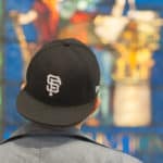 Harry Deng examines a piece of stained glass artwork at the High Museum of Art.