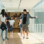 Iris Shi, left, and Harry Deng talk while walking through the High Museum of Art.