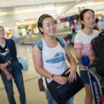 From right, Crystal Wang, Cathy Wu, Daisy Qiu make their way through Hartsfield-Jackson International Airport after arriving in Atlanta.