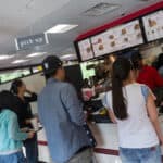 From right, Iris Shi, Lynn Lu, Daisy Qiu, Harry Deng, Cathy Wu place their orders at Chick-Fil-A