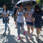 From right, Lavender Qin, Crystal Wang, Cathy Wu, Harry Deng, Iris Shi make their way toward the High Museum of Art in Atlanta.