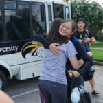 Daisy Qiu hugs Jordan Anderson, director of international students & programs, after arriving on Brenau's Historic Gainesville Campus.
