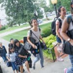 From front to back, Cathy Wu, Crystal Wang, Iris Shi, Lavender Qin, Lynn Lu, Harry Deng and Daisy Qiu arrive at the Owens Student Center.