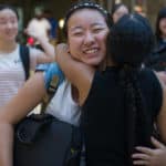 Cathy Wu gets a hug from Janet Grier, associate professor of education, at Hartsfield-Jackson International Airport.