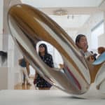 Lavender Qin looks at a piece of modern art.