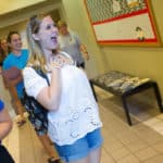 Erin Henderson, one of Brenau's student ambassadors, who recently traveled to China, reacts as she is reconnected with her classmates for the first time.