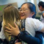 Daisy Qiu hugs Erin Henderson inside the Owens Student Center. Henderson traveled to China as a Brenau Ambassador in May.
