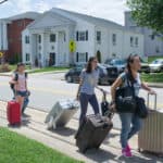 From right to left, Cathy Wu, Jordan Anderson, Crystal Wang and Harry Deng, wheel luggage across campus toward their new rooms.