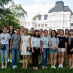 Front row from left to right, Jocelyn Heng, Miao Miao Yu, Alice Han, Lily Li, Lynn Lu, Belle Ni, Rachel Pei, Cherry Hong, Lavender Qin, Daisy Qiu and back row from left to right, Harry Deng, Iris Shi, Amy Yang, Cathy Wu, Skye Qi, Crystal Wang, Lisa Wang and Becky Xu pose for a group portrait on the front lawn of Brenau's Historic Gainesville Campus.