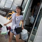 Jocelyn Heng gets off the bus after a shopping trip to Walmart.